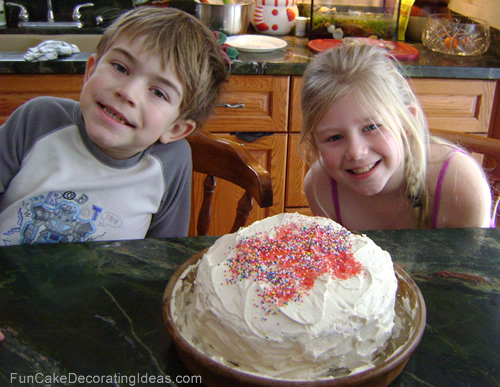 Kids decorating a cake